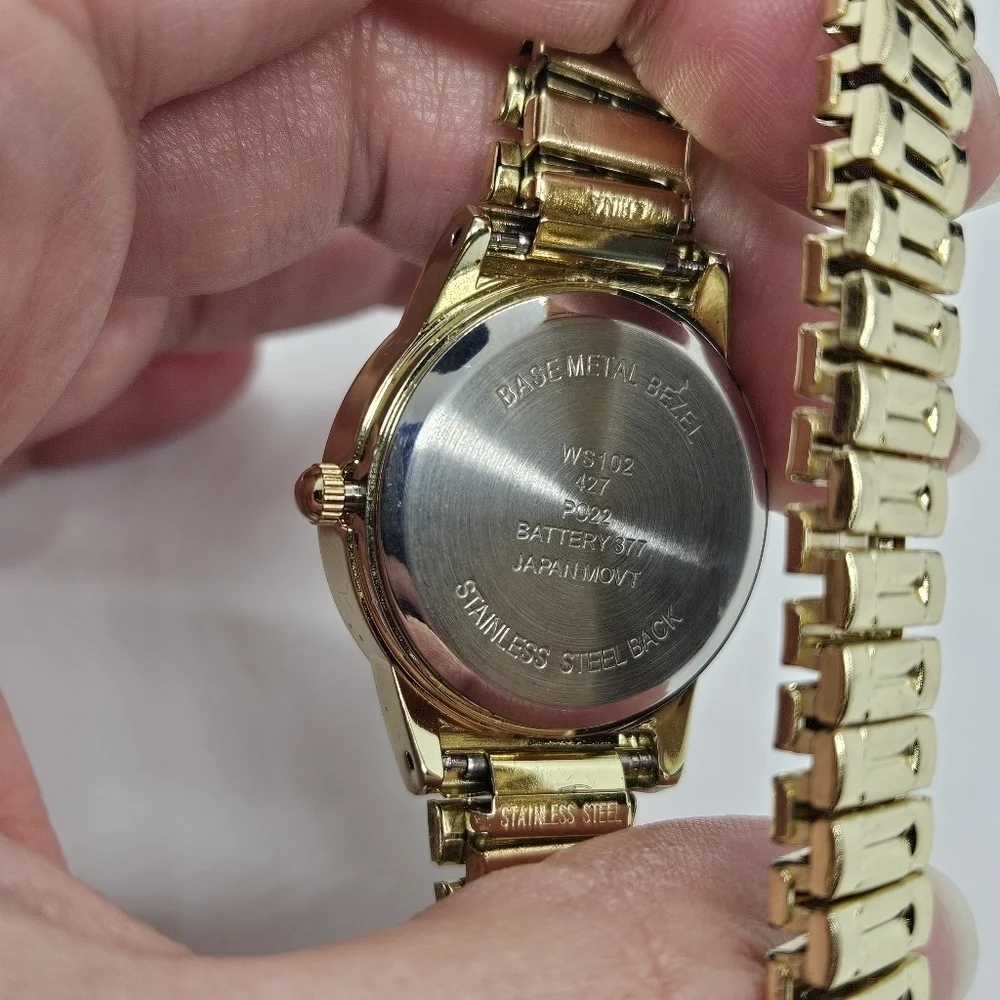 gold tone stretch watch with rhinestone case